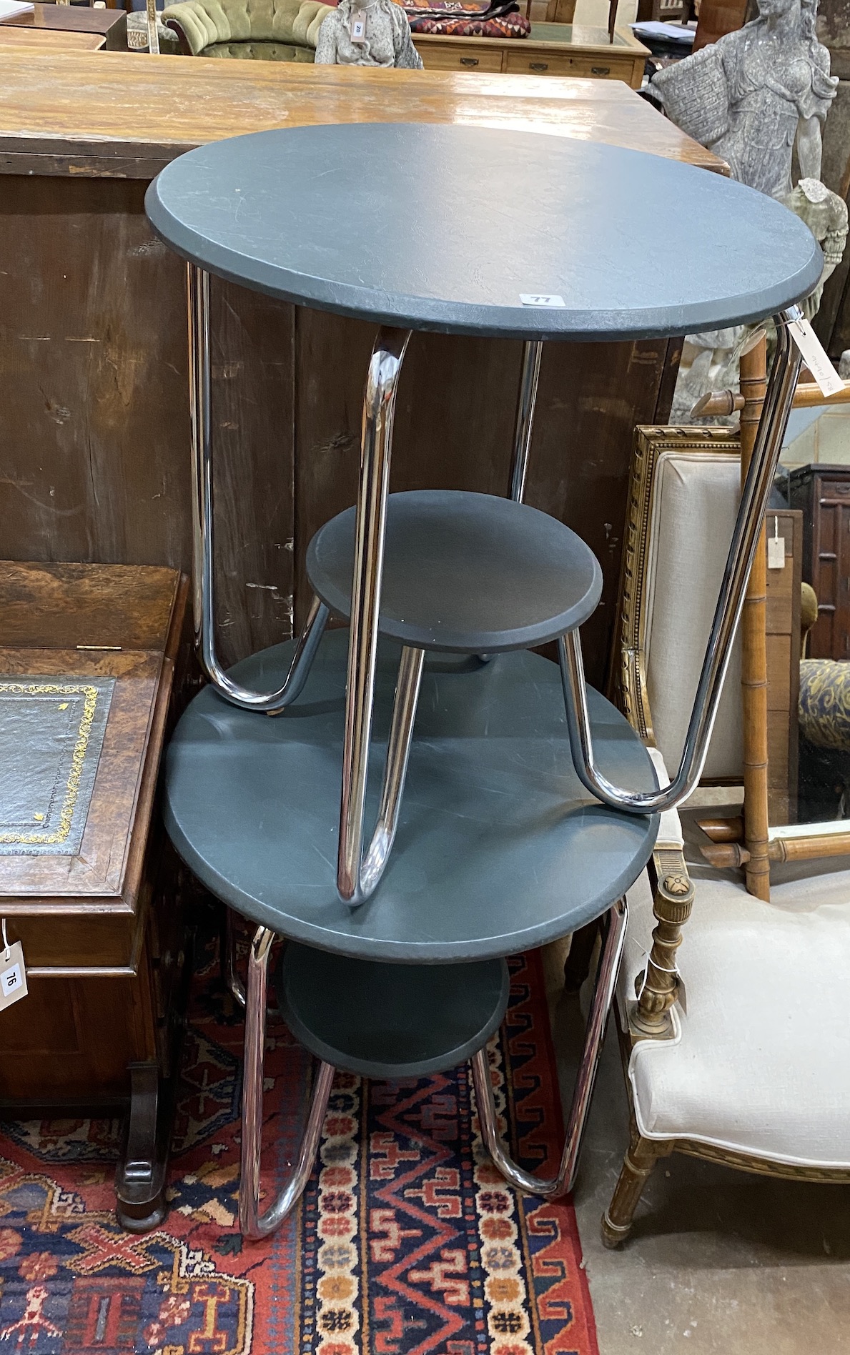 A pair of mid century Marcel Bruer style circular two tier occasional tables, diameter 60cm, height 65cm